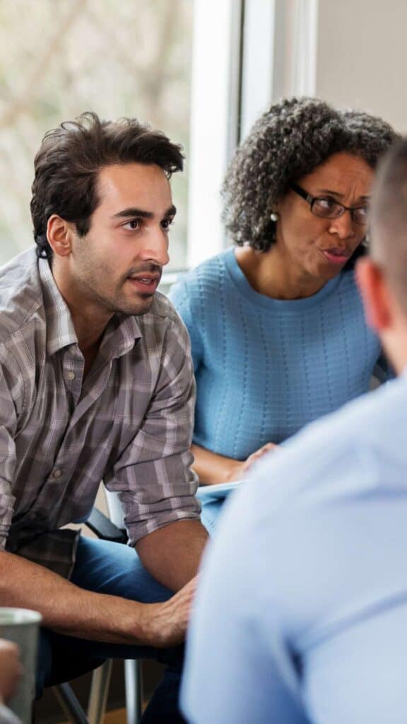 Group Therapy Session Person Sharing to Group